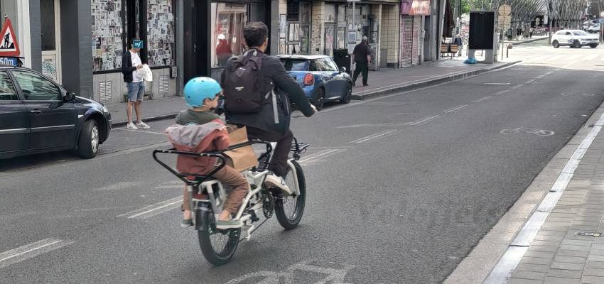 Electric longtail bike with child seat at the back